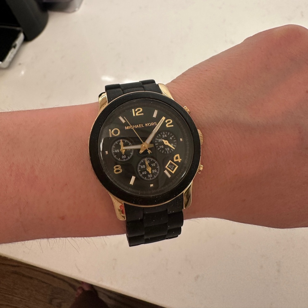 Matte black and gold Michael kors watch